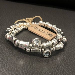 UNO de 50 bracelet with smokey gray and clear stones. Titled “Acristalada”